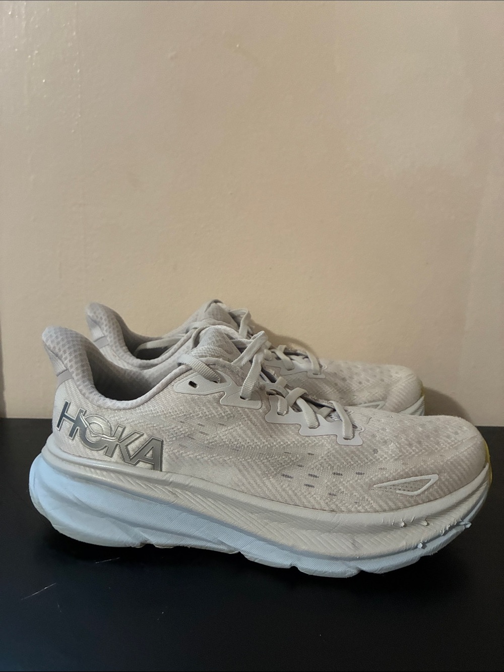 Hoka Clifton 9 running shoes featuring a lightweight gray mesh women’s size 9